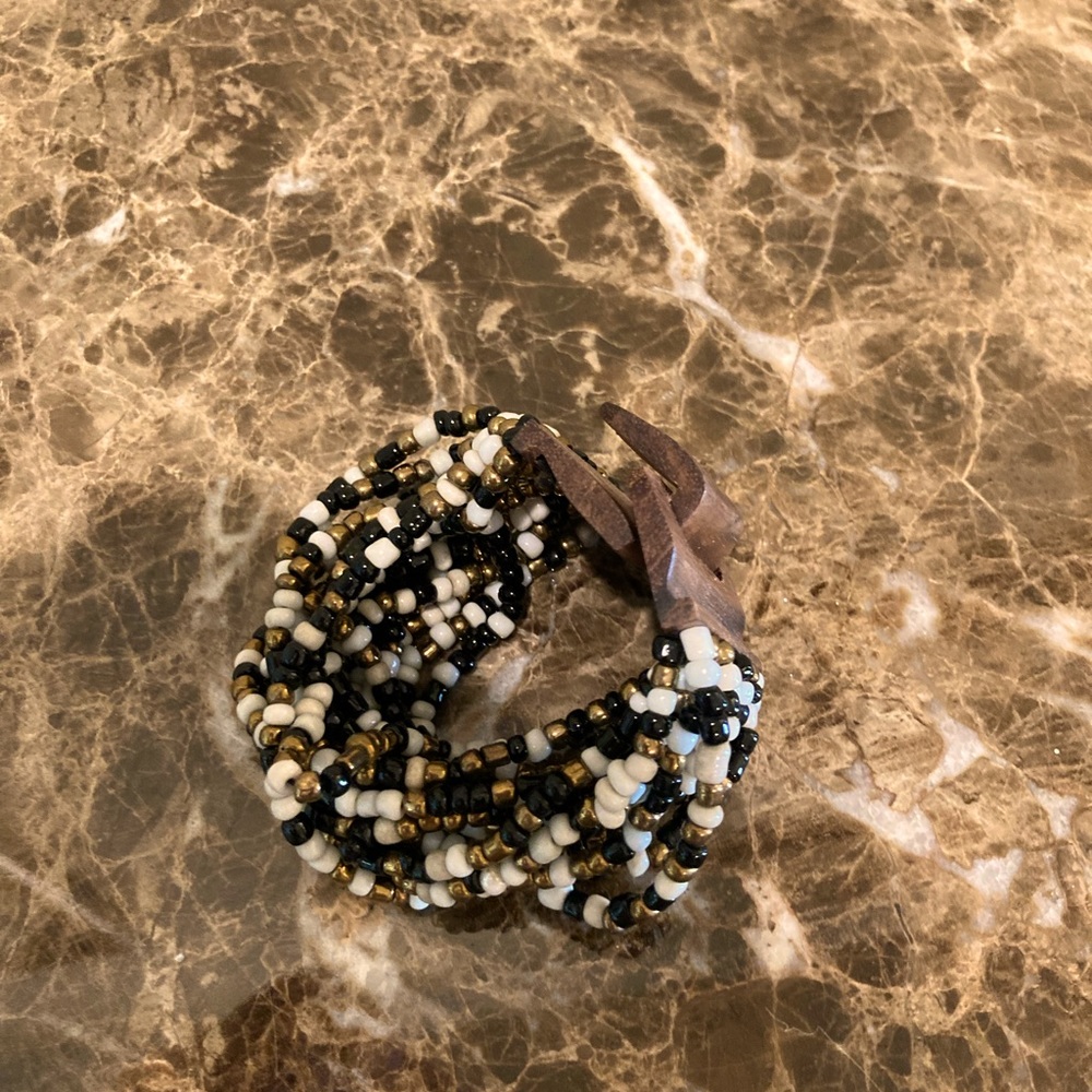 Bracelets-white, black and gold beads-the other blue, gold and white beads.